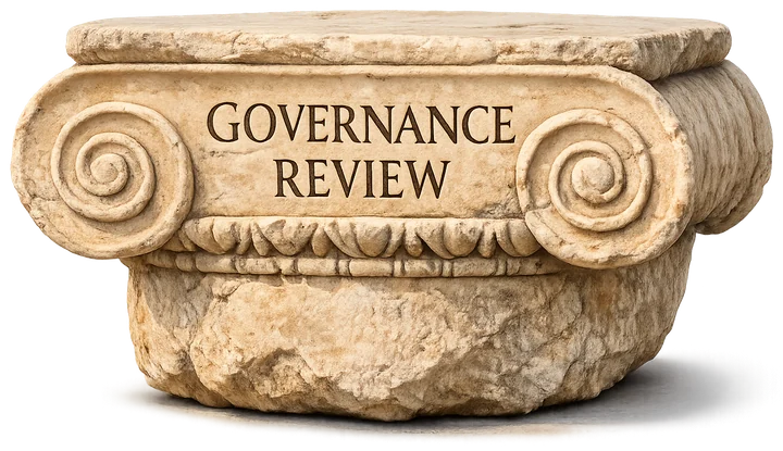 An Ionic marble capital carved with the words Governance Review.